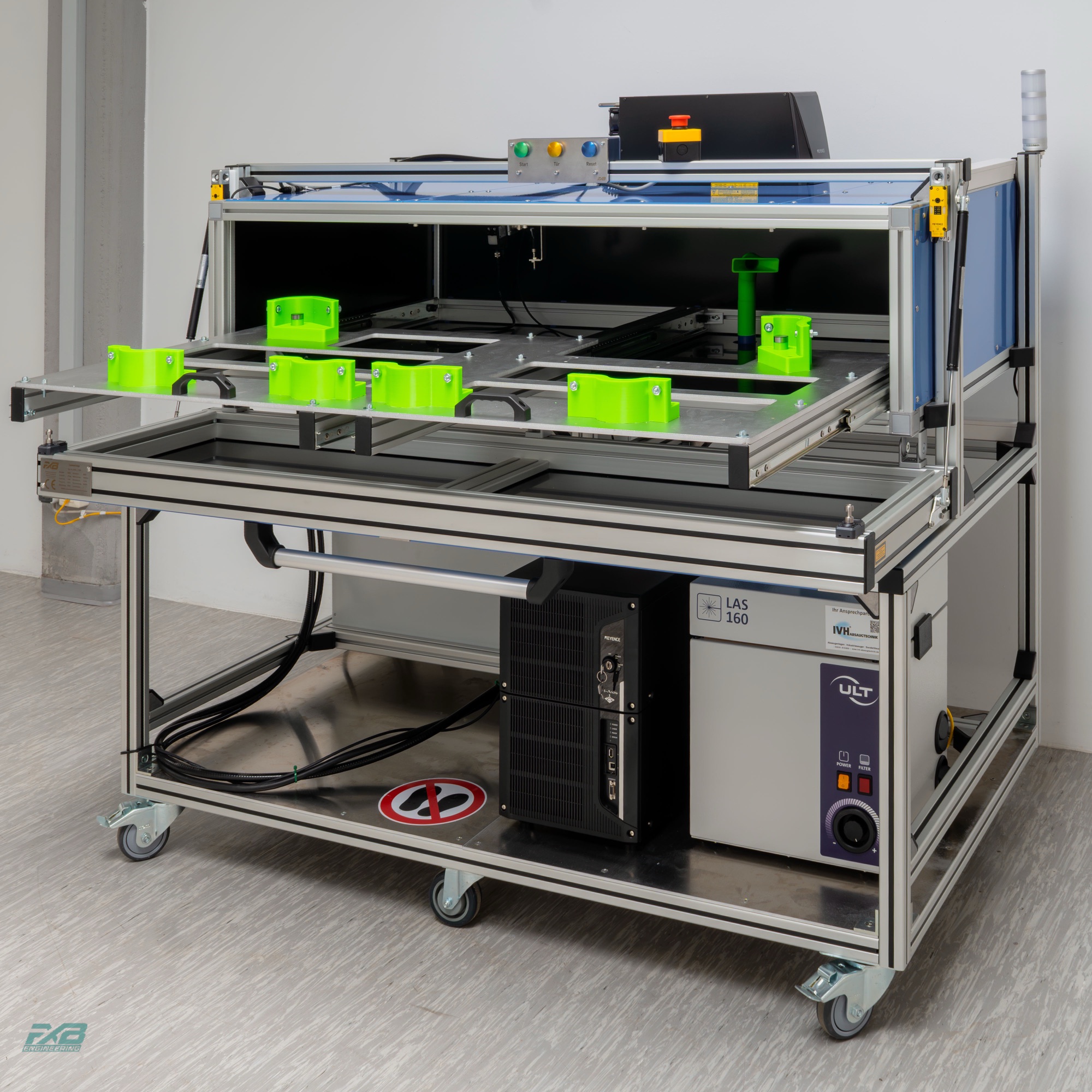 Laser cabin with extended drawer and part fixtures